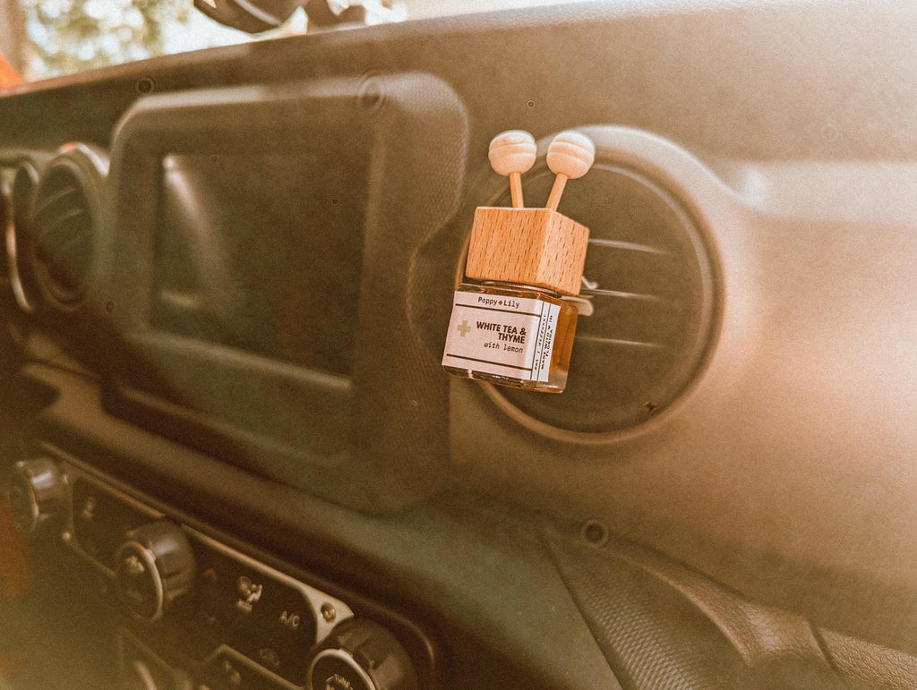 Car air freshener with wooden design on a car dashboard